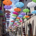 Pietrasanta, Lucca: the main street with colorful umbrellas